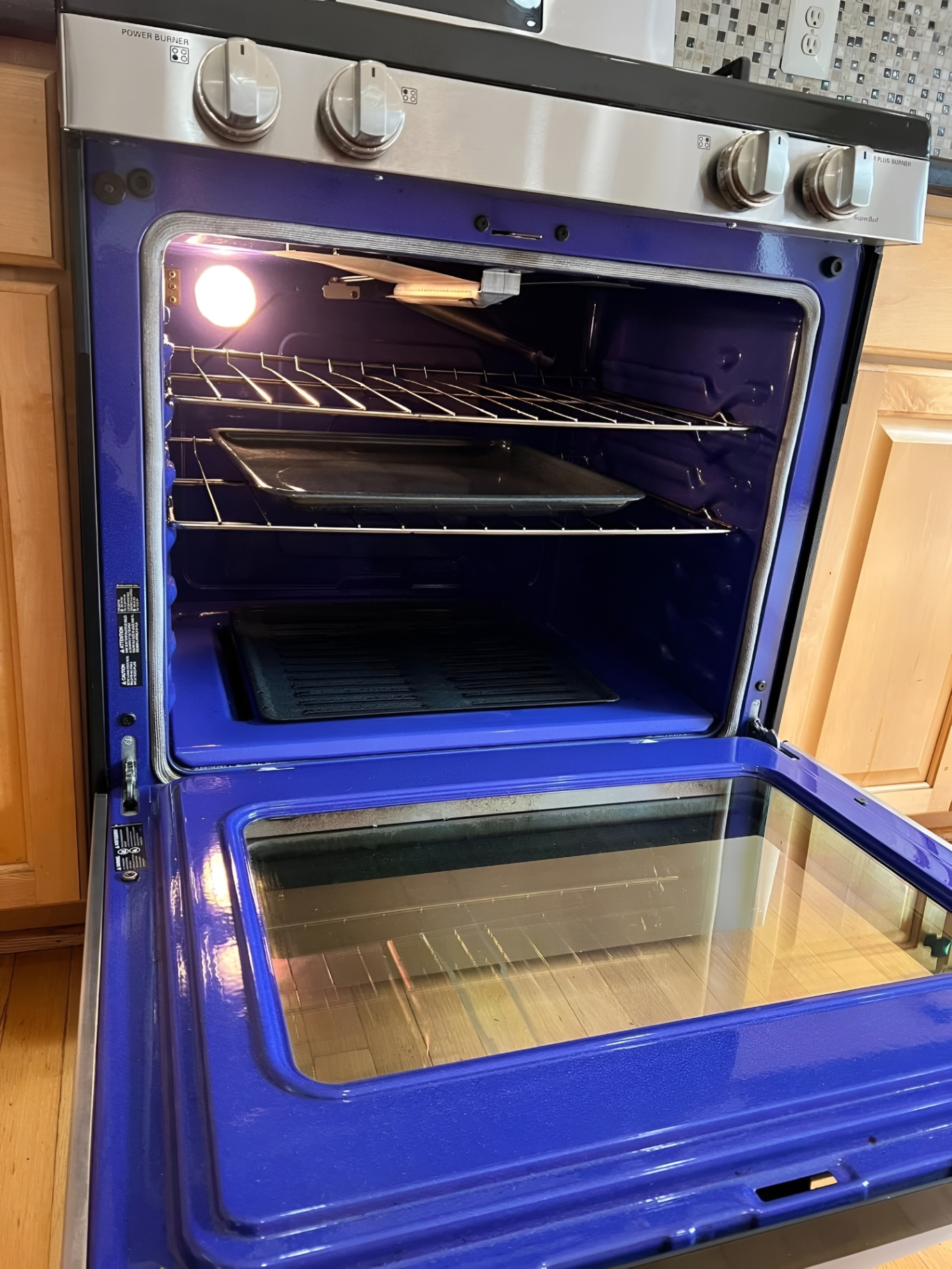 Inside of a cleaned oven with racks restored and shining